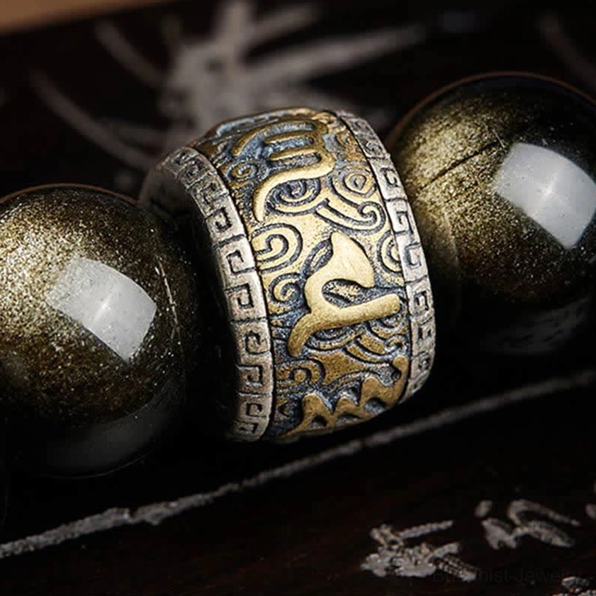 Buddhist prosperity and protection bracelet featuring natural obsidian and cinnabar materials