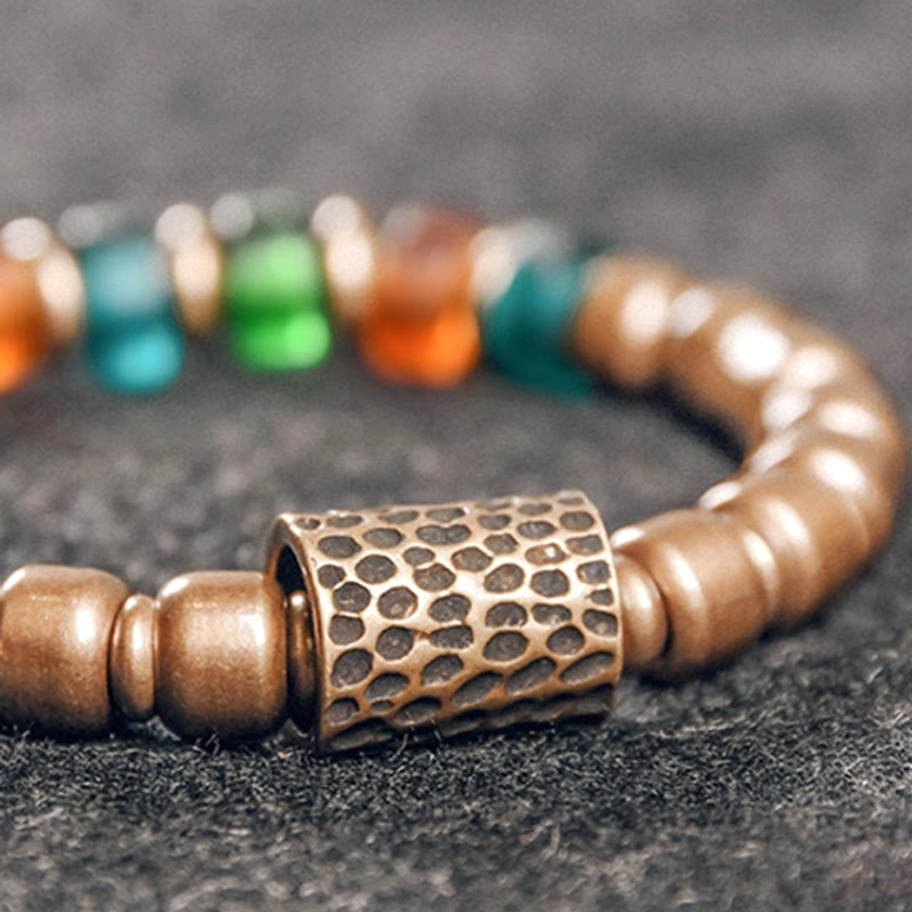 Buddhist bracelet for protection and abundance handcrafted copper and glass beads artisan detail
