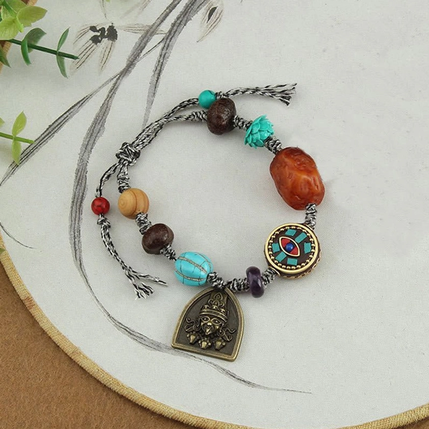 Close-up detailed view of handcrafted Buddhist protection bracelet showing quality craftsmanship and material composition