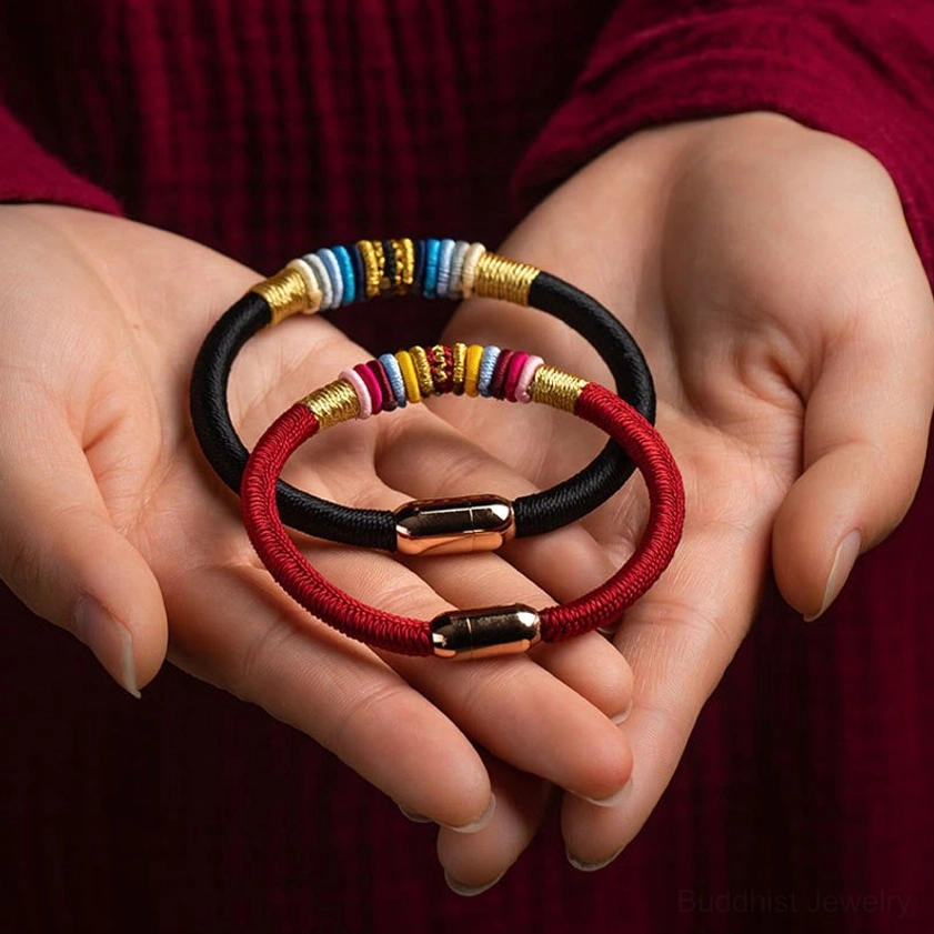 Close-up detail of woven Buddhist protection bracelets with magnetic clasp - multiple color styles displayed