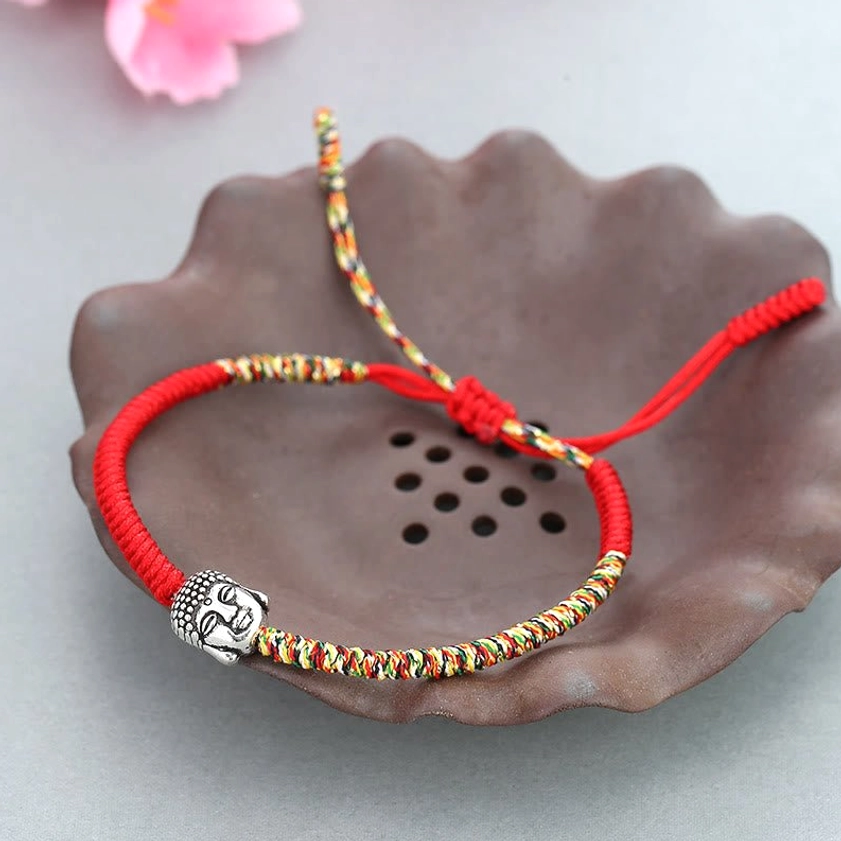 Adjustable Buddhist red string bracelet with protective King Kong knot, colorful braided section and Buddha charm