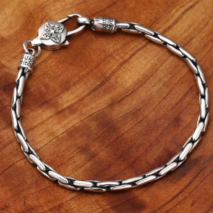 Buddhist protection bracelet with sacred symbols including Om Mani Padme Hum and double dorje for spiritual strength