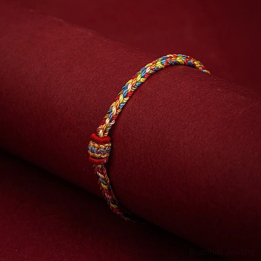 Wrist wearing demonstration of Buddhist lucky string bracelet showing comfortable fit and ethnic decoration knot on arm