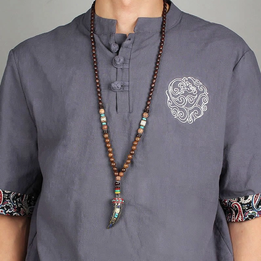 Buddhist protection necklace with sacred symbols and natural wenge wood beads