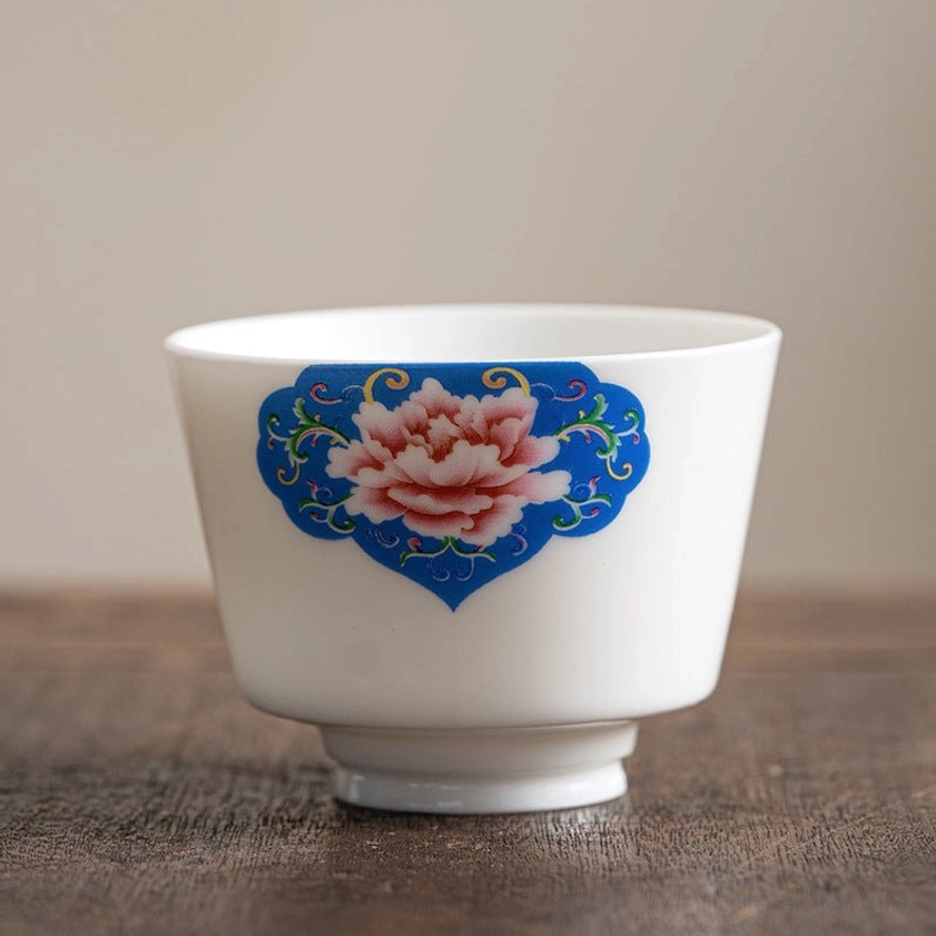 Premium handcrafted Buddhist ceramic tea cup with red peony flower motif symbolizing auspicious fortune and happiness
