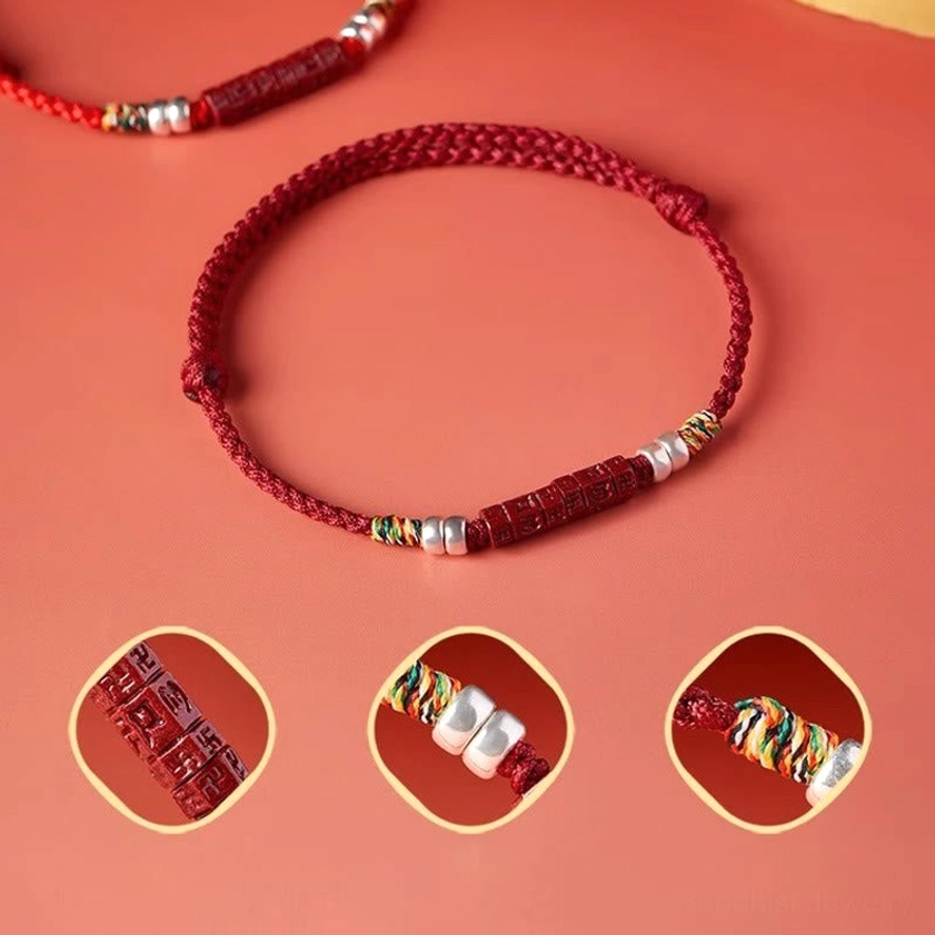 Red prayer bracelet with detail insets showing sterling silver components and carved cinnabar charm details