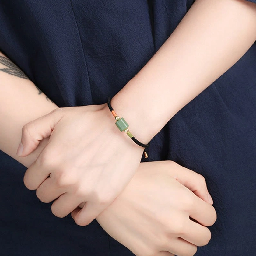 Red stone Buddhist protection bracelet with adjustable braided rope and copper-plated gold sliding clasp