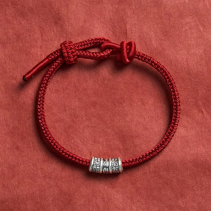 Buddhist red string bracelet lifestyle wear guide showing how to style and wear the mantra bracelet daily