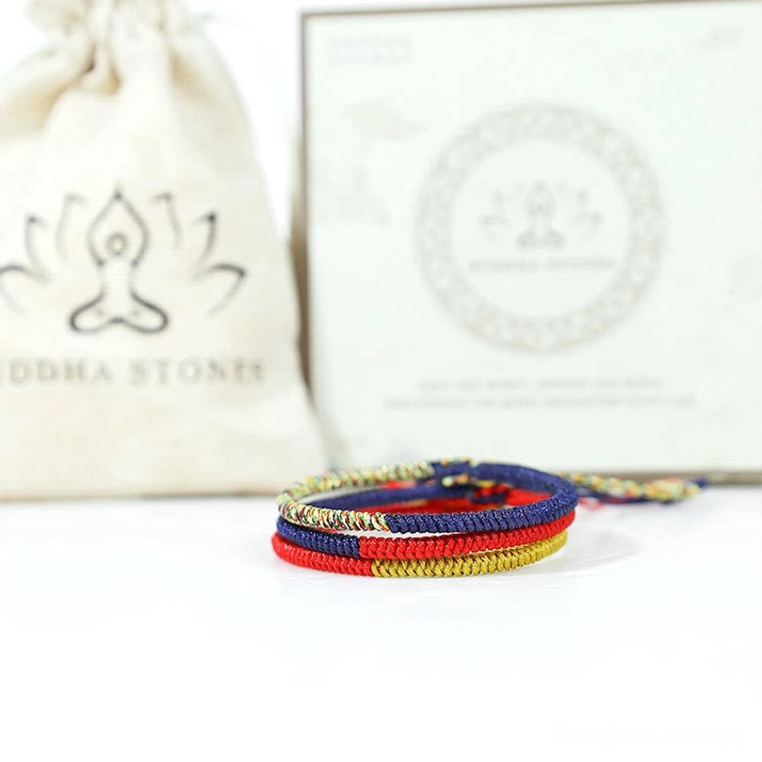 Buddhist string protection bracelet with branded packaging and product information card