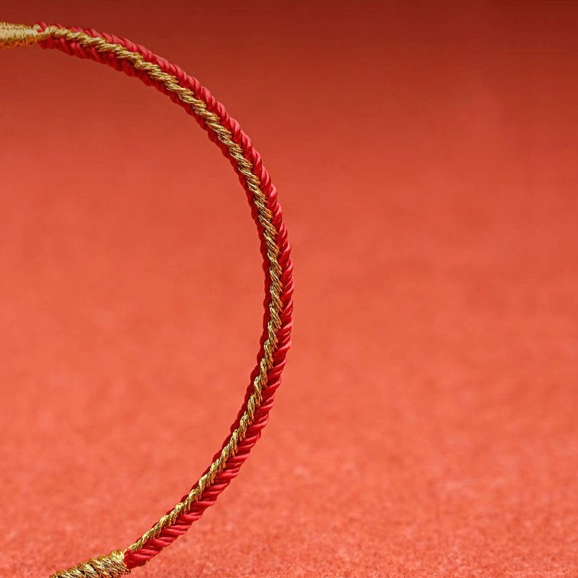 Solid red twisted cord handmade Buddhist string bracelet with gold thread accent