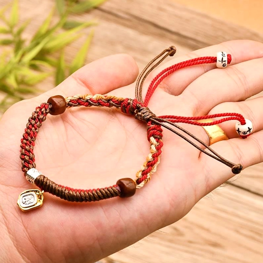 Red Buddhist protection bracelet with wooden beads and adjustable drawstring, Zakiram goddess wealth symbol