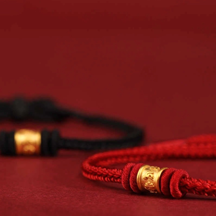 Buddhist red string bracelet with precious gold mantra bead, meditation and mindfulness tool