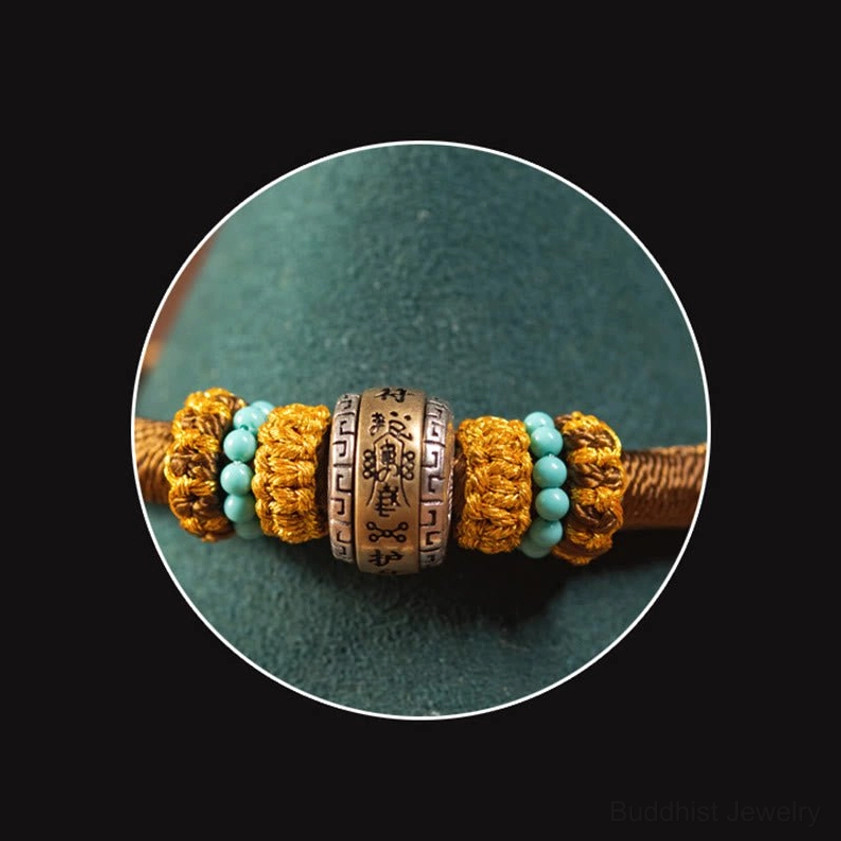 Buddhist red string bracelet with traditional King Kong Knot symbol on minimalist background