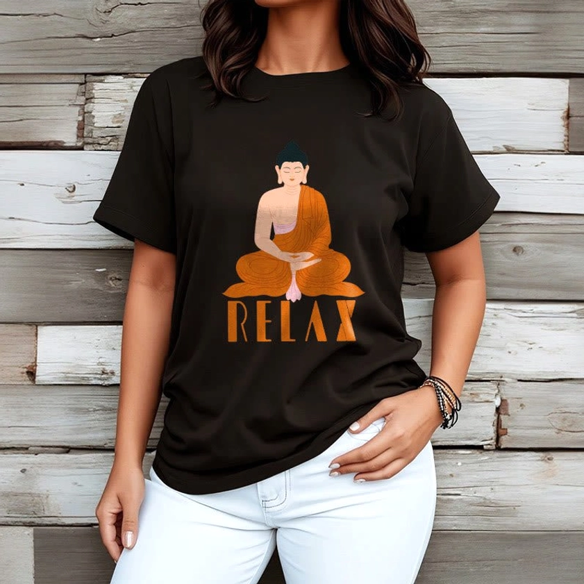 Female model front view wearing matte black Buddhist Relax tee with Buddha and RELAX lettering on wood panel background