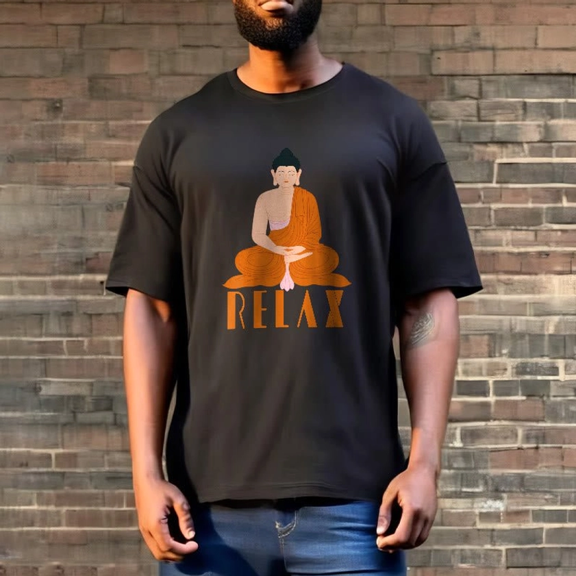 Male model wearing dark charcoal black Buddhist Relax graphic t-shirt with Buddha print on brick wall background