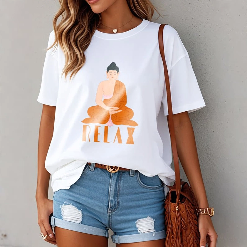 Female model wearing white Buddhist Relax graphic tee with seated Buddha design, front view indoor setting