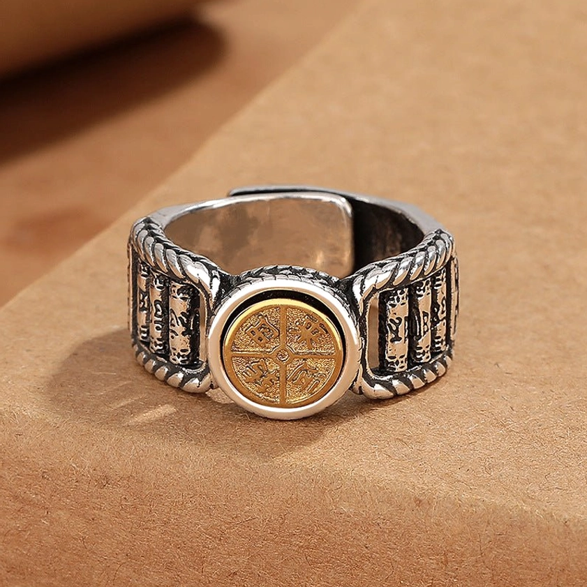 Buddhist mantra ring with two-tone copper metal and engraved sutra patterns on rotating disc