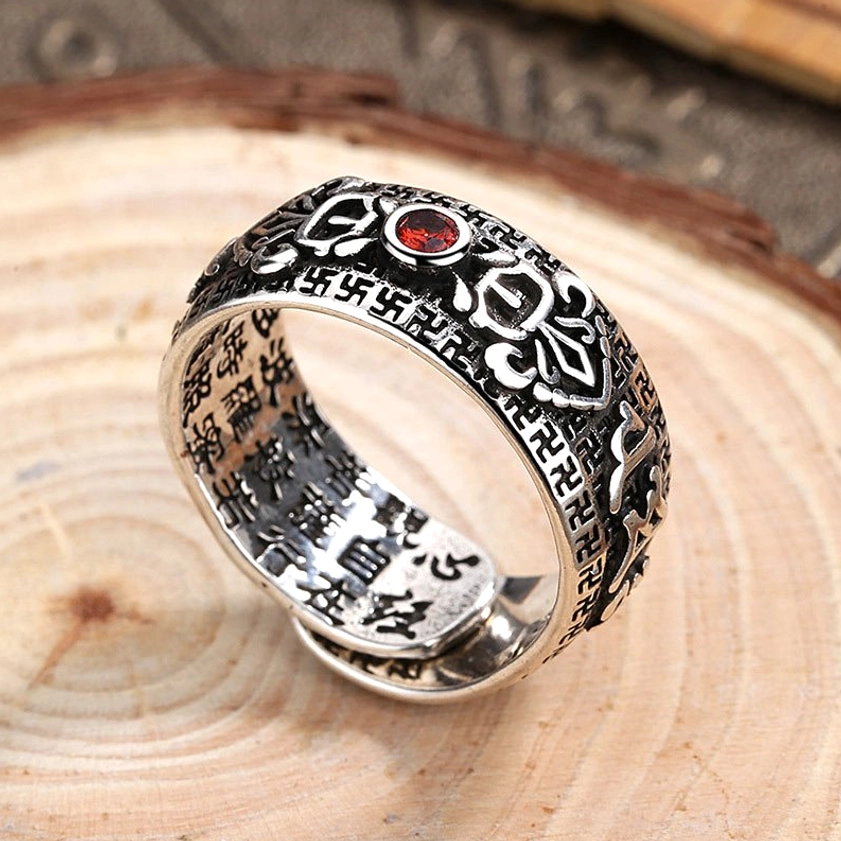 Copper ruby Buddhist ring side profile showing inner ring with Chinese Buddhist sutras and outer vintage decorative patterns, artisan handmade detail
