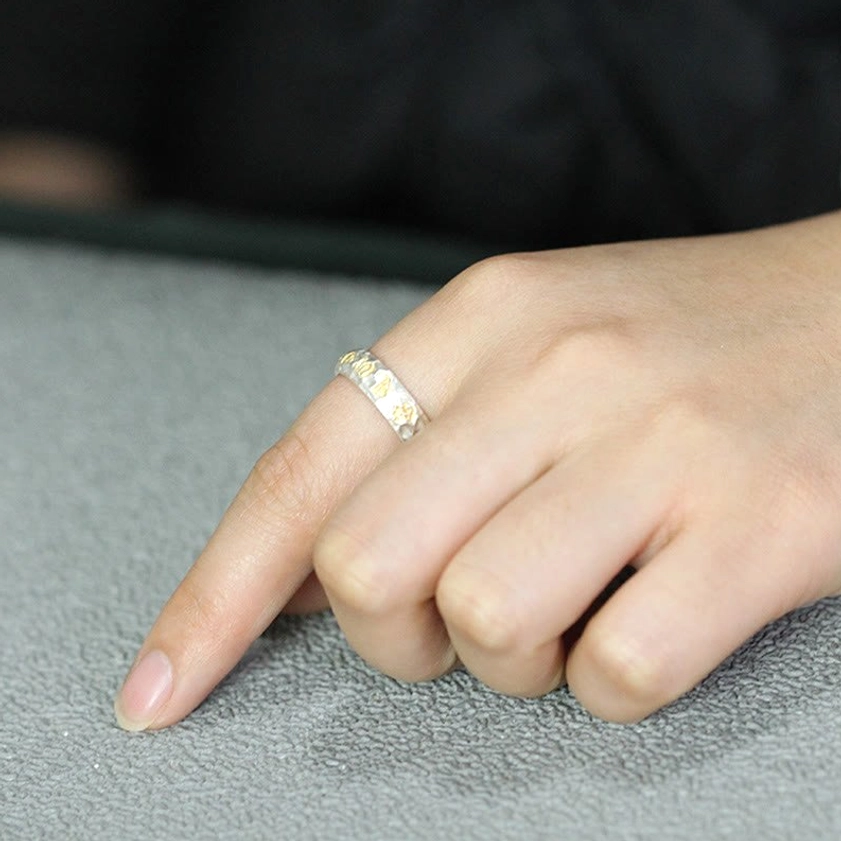 Buddhist Om Mani Padme Hum ring unboxing presentation showing gift packaging and care instructions