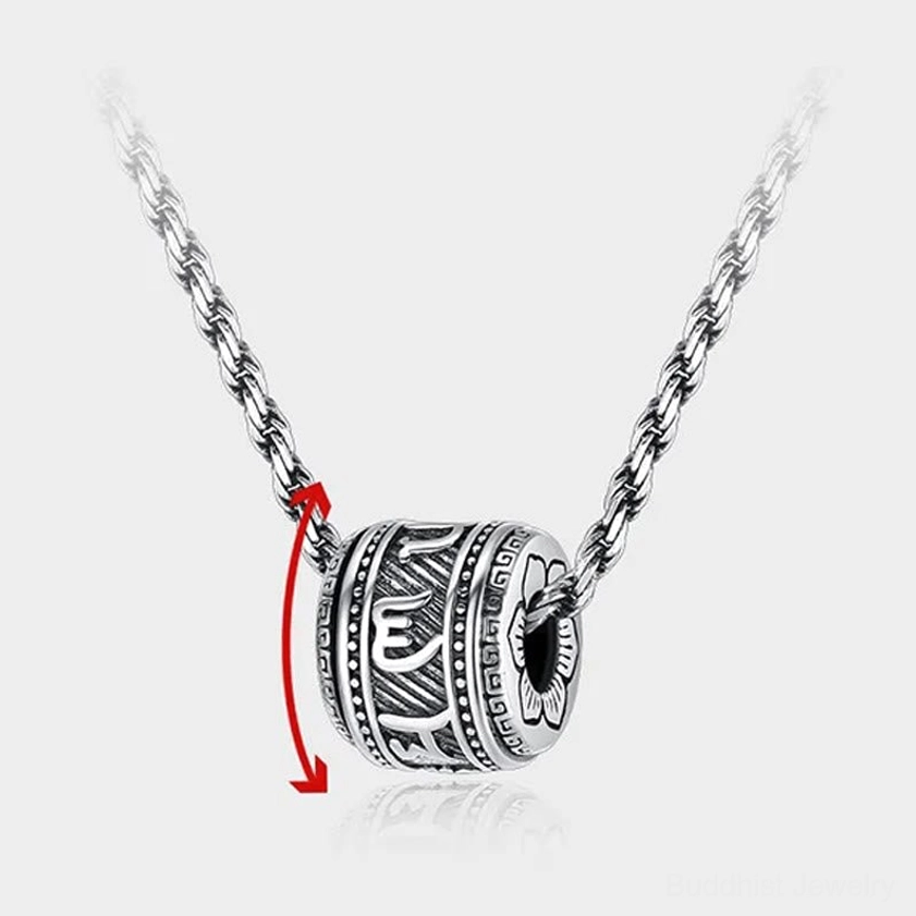 Rotatable Buddhist pendant necklace showing engraved mantras, turning mechanism for meditation practice