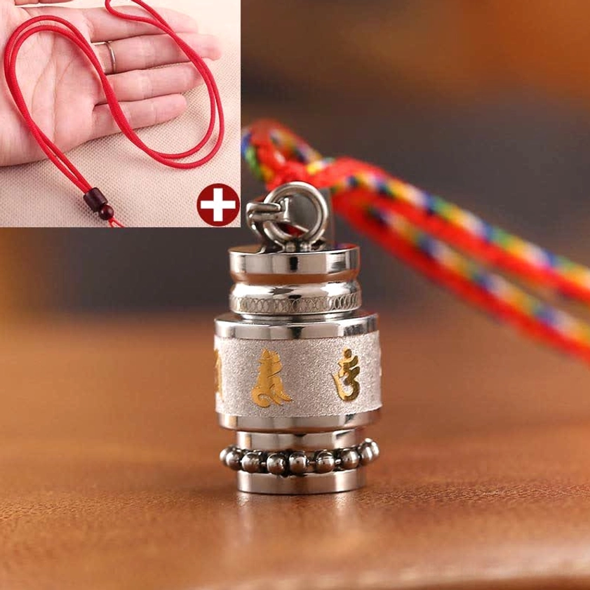 Buddhist prayer wheel pendant with spiritual Sanskrit mantras frosted surface texture detail