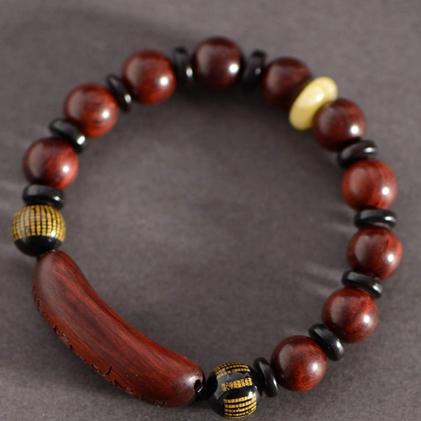 Red sandalwood Om Mani Padme Hum bracelet front view with positioned mantra bead