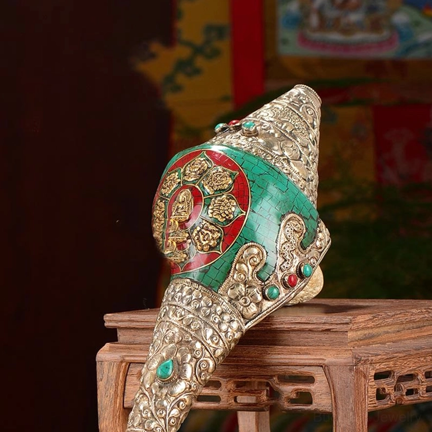 Buddhist conch shell Shankha decoration with sacred dharma symbols, handcrafted silver engravings promoting spiritual protection and positive energy