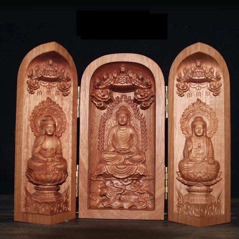 Polished carved wood Buddhist altar shrine with seated Buddha statues on lotus thrones and gilded hinges