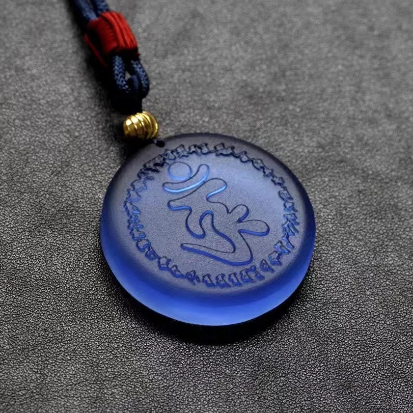 Shurangama Mantra Buddhist pendant necklace front view showing engraved sacred mantra with protective aura