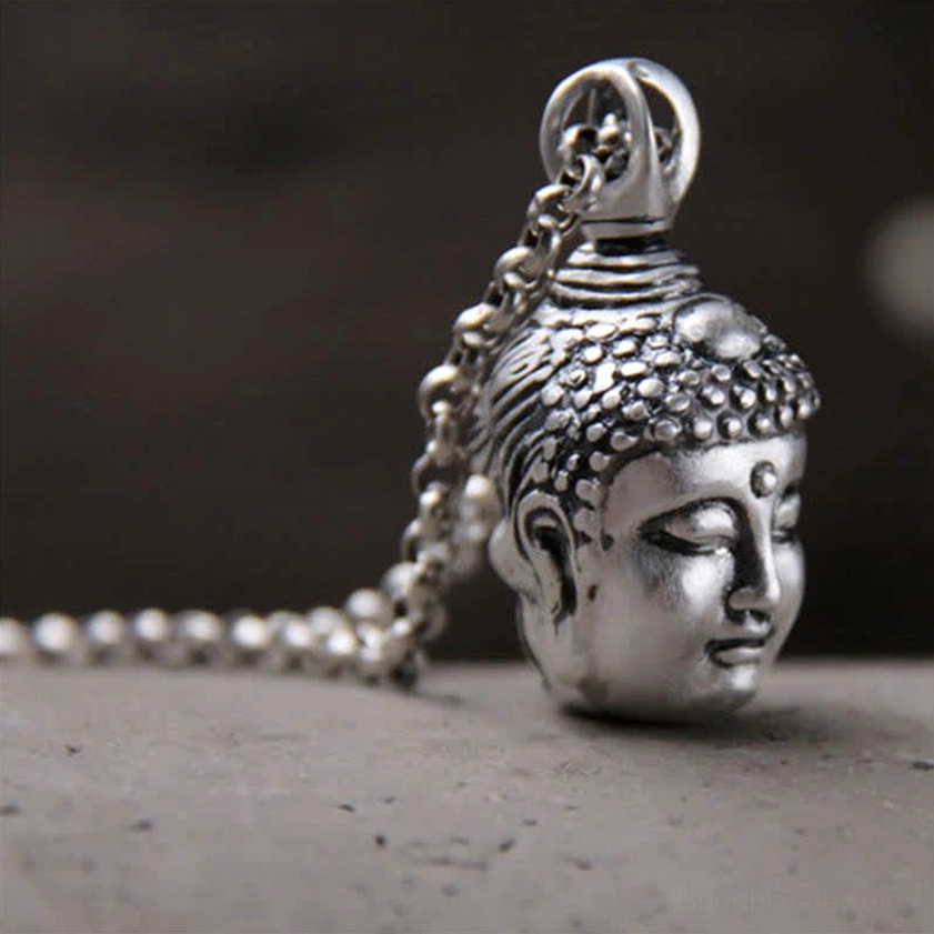 Sterling silver Buddha pendant with rolo chain, right side profile showing serene closed-eyes Buddha carving