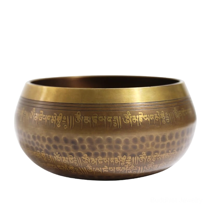 Full-profile studio view of antique bronze singing bowl with Sanskrit mantras and hand-hammered surface finish