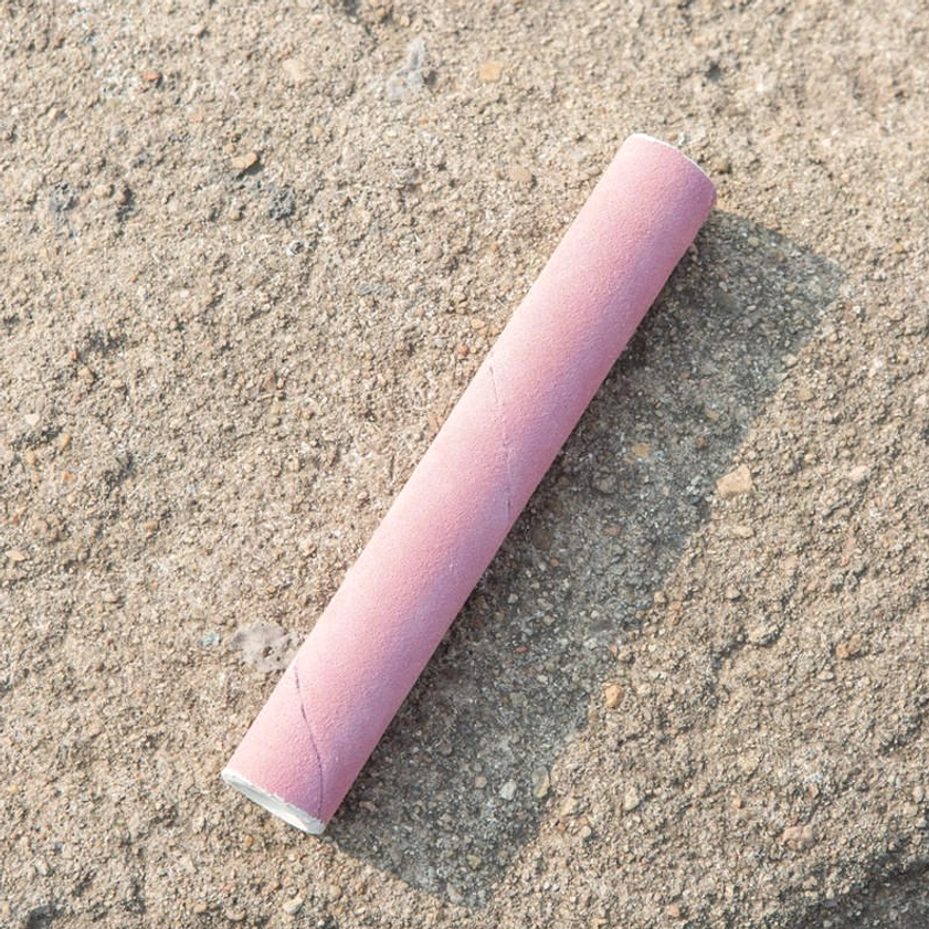 Leather striker mallet for Buddhist singing bowl with matte pink finish and white trim end caps