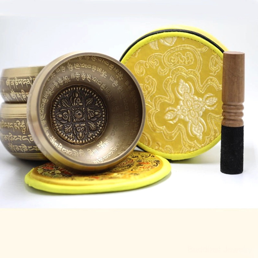 Full meditation singing bowl set including multiple brass bowls, embroidered cushions in assorted colors, wooden mallets, and protective drawstring bags