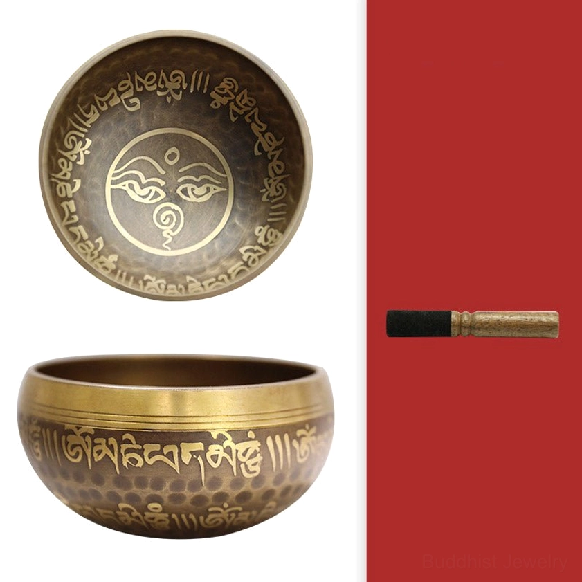 Buddhist singing bowl meditation practice set components including bowl, wooden mallet, and felt striker head