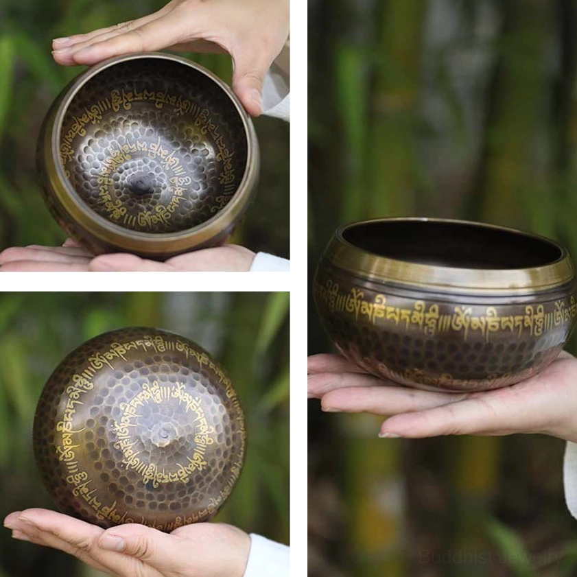 Miniature handcrafted Buddhist singing bowl held in single hand, same mantra design as standard sizes, photographed in outdoor bamboo forest setting
