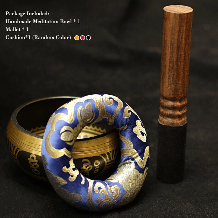 Complete Buddhist singing bowl meditation set with blue embroidered cushion, wooden mallet striker, and brass bowl with product specifications