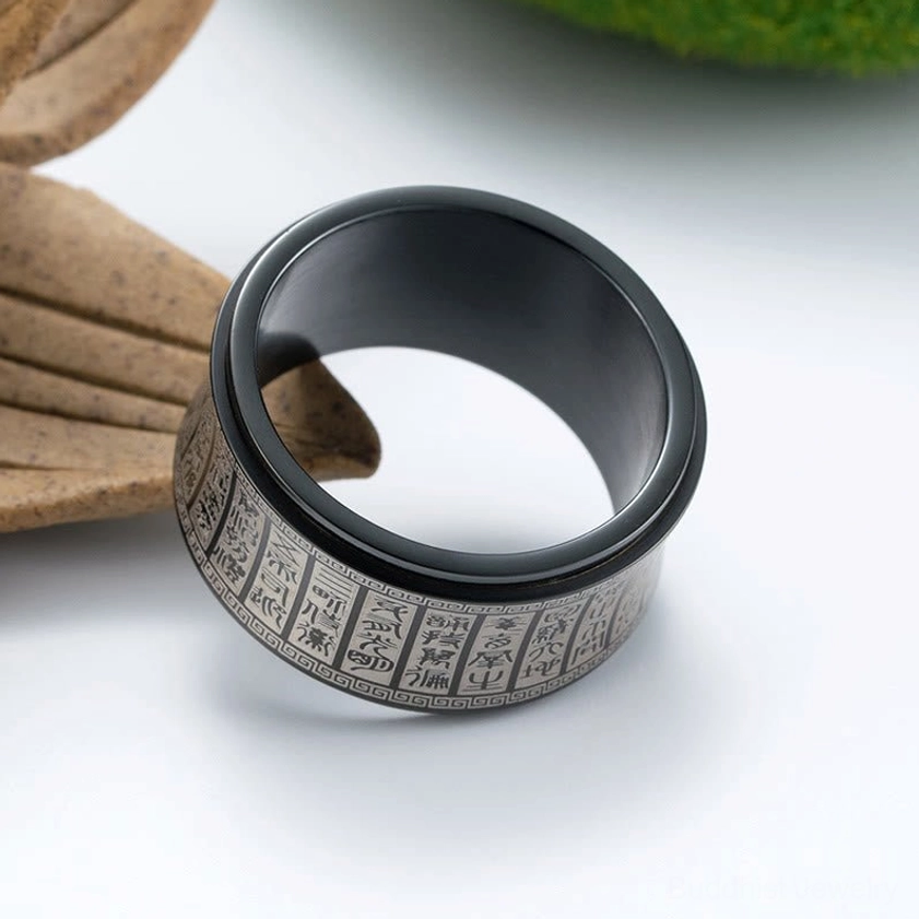 Golden and black Buddhist spinner ring style comparison - color variations