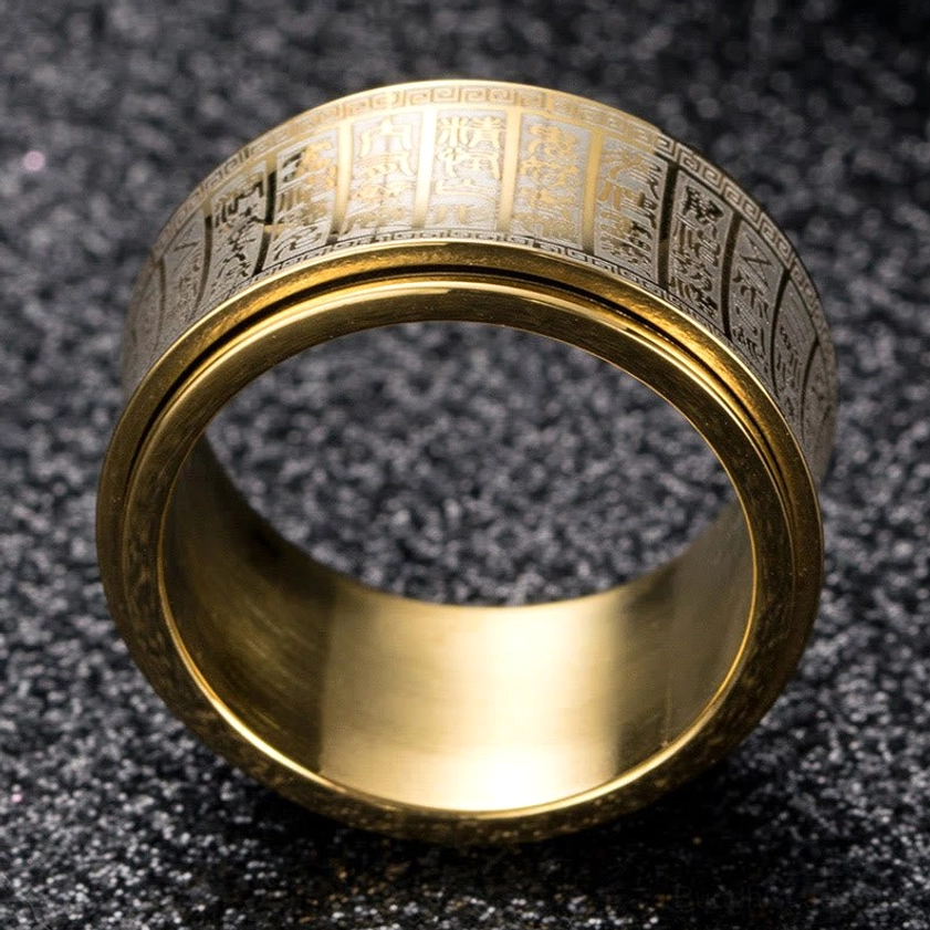 Inner polished gold band of titanium steel mantra ring showing engraved detail