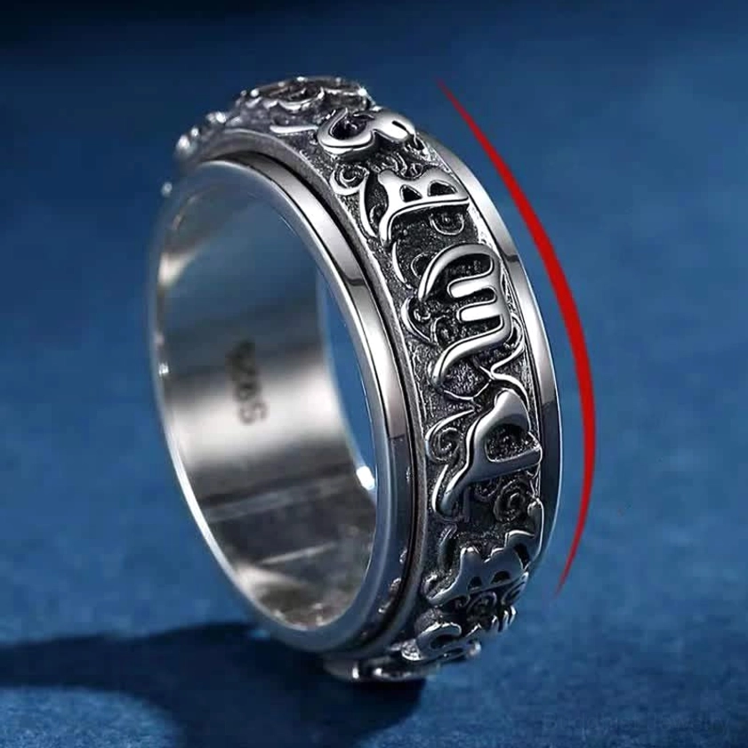Side profile of spiritual spinner ring showing vintage copper finish and intricate engraving detail