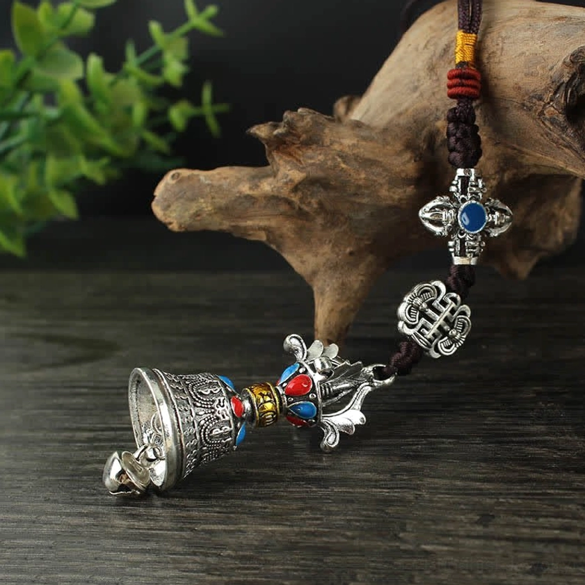 Buddhist car hanging ornament with sacred symbols and protective Vajra design for spiritual journey