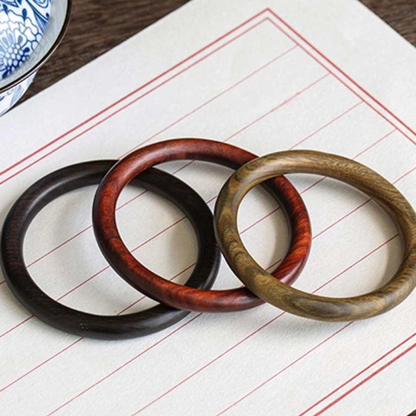 Buddhist Spiritual Protection Bangle - showing wrist wear lifestyle with natural polished wood materials