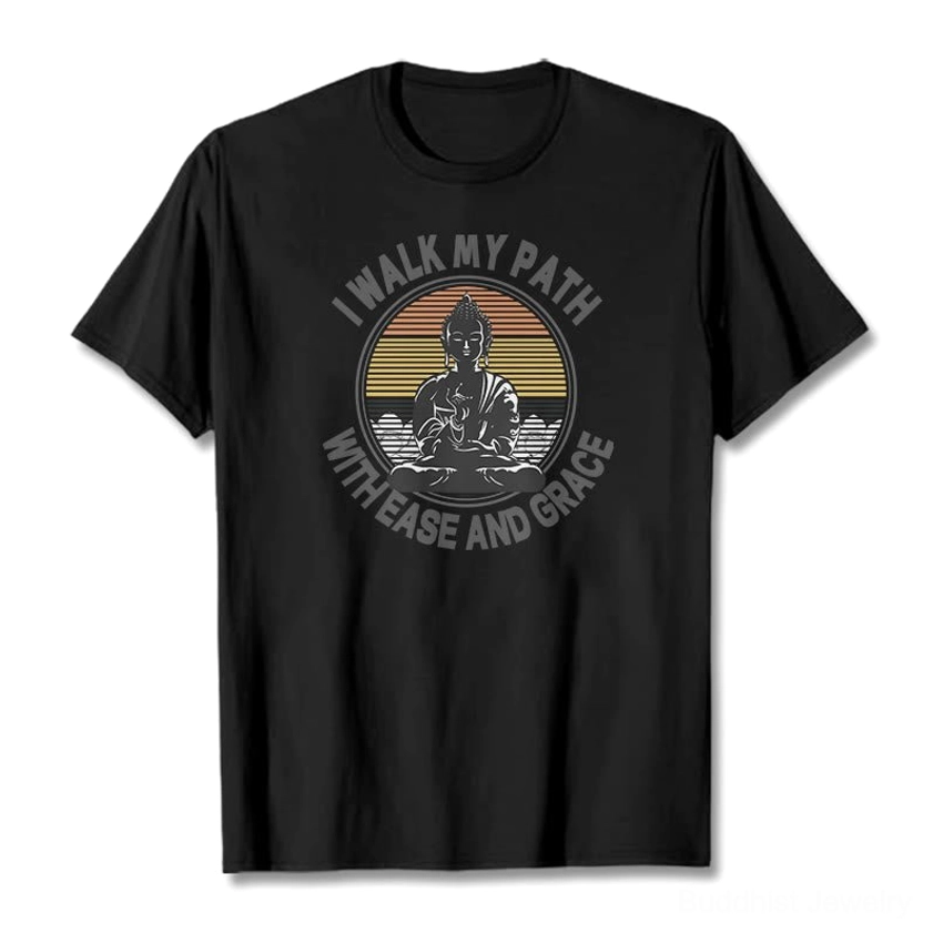 Black Buddhist graphic t-shirt with ease and grace spiritual print flat lay on dark background