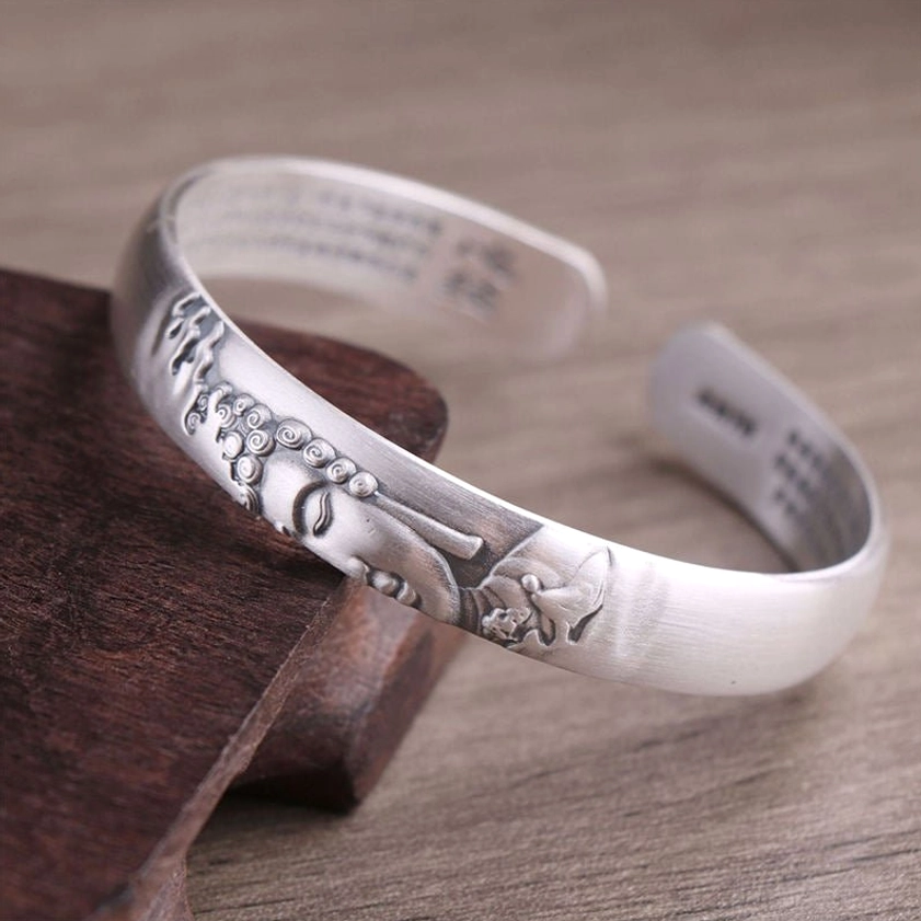 Premium 999 sterling silver Buddhist cuff bracelet featuring embossed Buddha head symbol, inner Heart Sutra text, perfect for meditation and spiritual practice