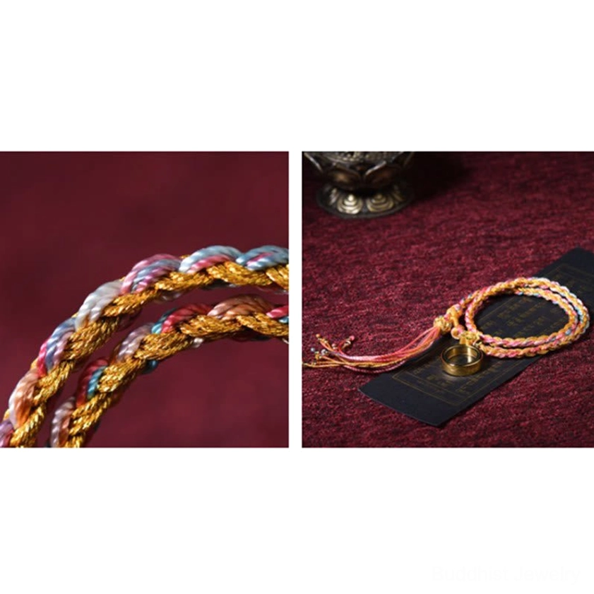 Close-up macro detail of handmade Buddhist braided string bracelet showing twisted multicolor woven rope texture