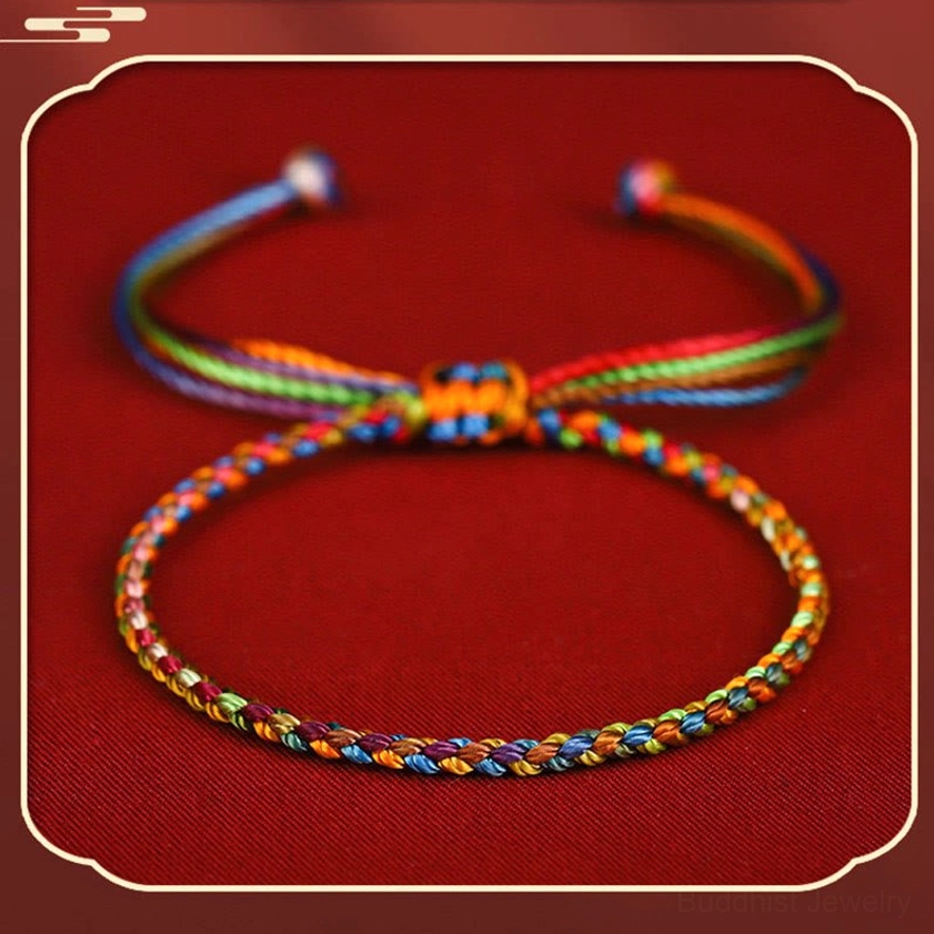 Two handcrafted multicolored Buddhist protection bracelets with rainbow braid and adjustable knot closures