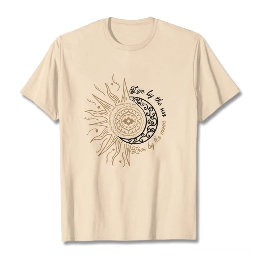 Beige tan Live by the Sun Love by the Moon Buddhist t-shirt flat lay with gold and black celestial print