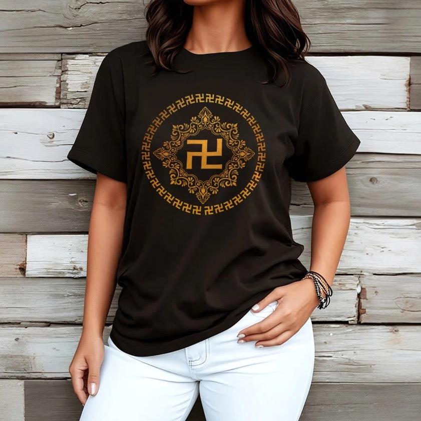 Woman wearing black Buddhist swastika spiritual t-shirt with golden mandala graphic