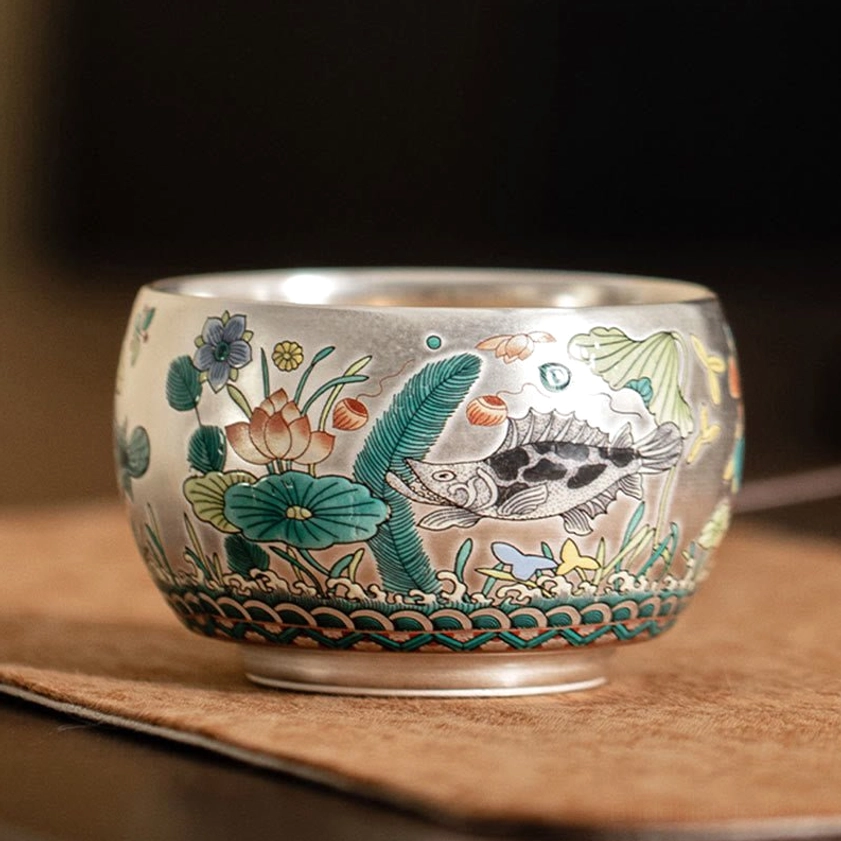 Buddhist ceramic kung fu tea cup detailed view showing intricate brushwork aquatic floral-fish artwork