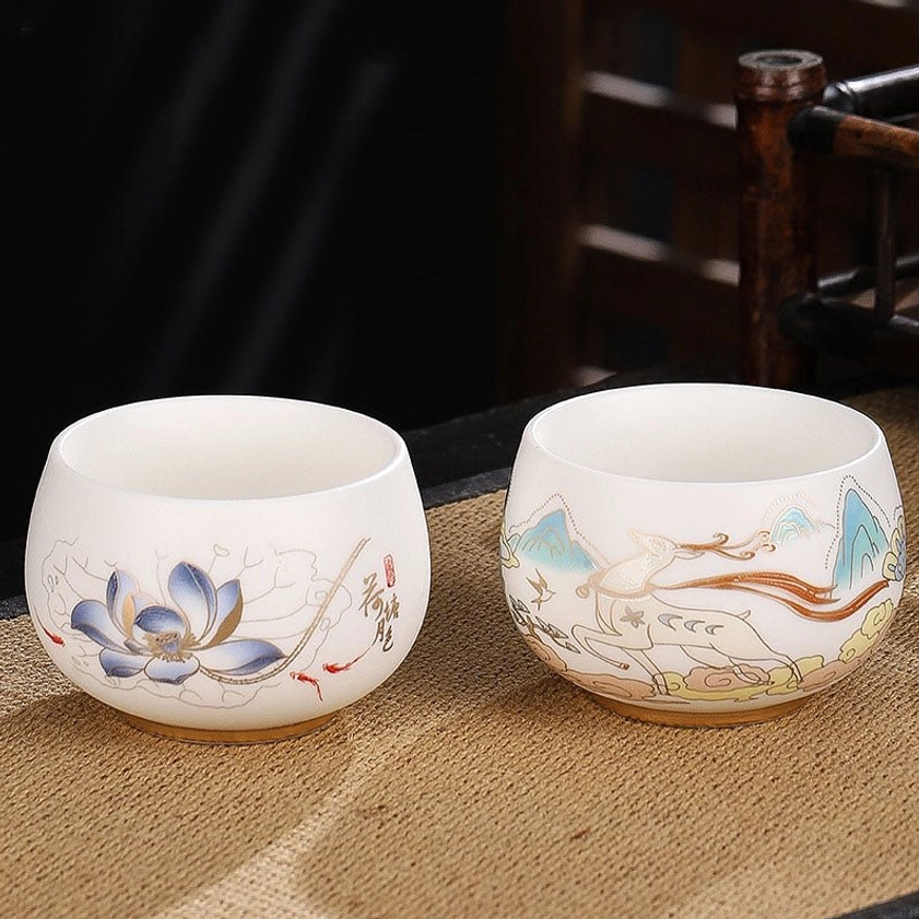 Delicate plum blossom ceramic gongfu tea cup representing resilience, renewal, and new beginnings