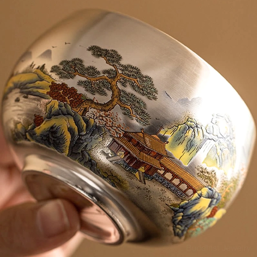 Buddhist ceramic kung fu tea cup with wave pattern trim and colorful floral-fish decorative details
